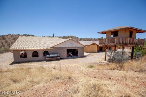 480 Camino Ramanote, Rio Rico, AZ 85648 - rear view of property with a garage and a deck