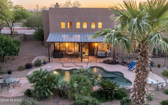 9387 S Via Famero, Vail, AZ 85641 - back of property featuring a patio area, a fenced backyard, stucco siding, and a chimney