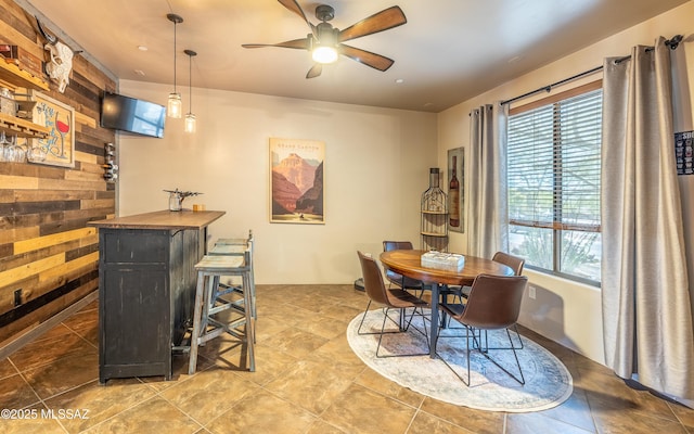 9387 S Via Famero, Vail, AZ 85641 - dining room featuring plenty of natural light, ceiling fan, a bar, recessed lighting, and wood walls