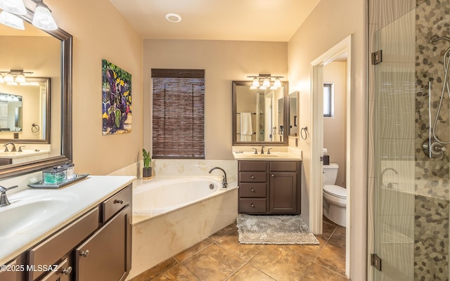 9387 S Via Famero, Vail, AZ 85641 - full bath with a stall shower, two vanities, a garden tub, and toilet