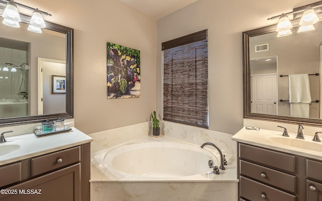 9387 S Via Famero, Vail, AZ 85641 - full bathroom with two vanities, a bath, and a shower