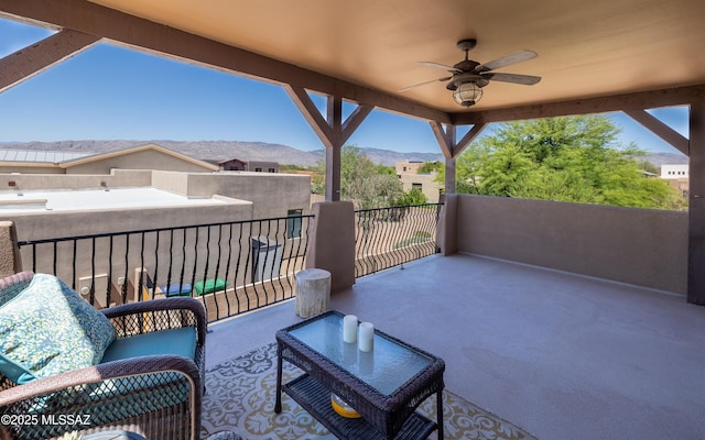 9387 S Via Famero, Vail, AZ 85641 - view of patio / terrace with a balcony, a mountain view, and a ceiling fan