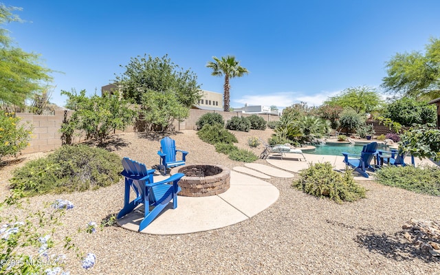 9387 S Via Famero, Vail, AZ 85641 - fenced backyard featuring a fire pit and a patio