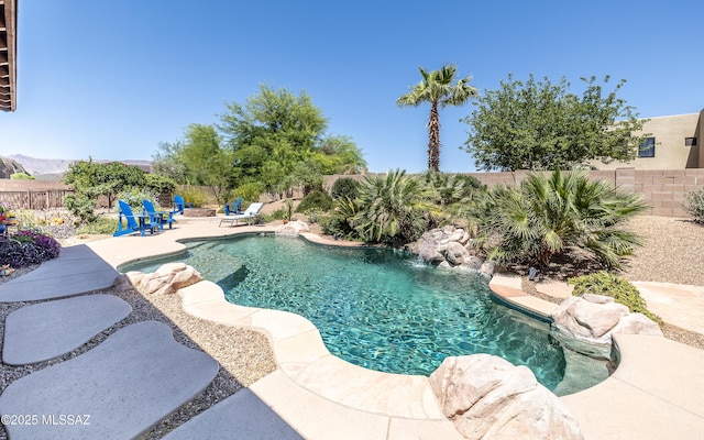 9387 S Via Famero, Vail, AZ 85641 - view of pool with an outdoor fire pit, a fenced backyard, and a patio area
