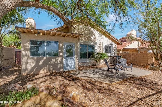 11561 N Eagle Peak Dr, Oro Valley, AZ 85737 - back of house featuring stucco siding, a chimney, a patio area, and a tile roof