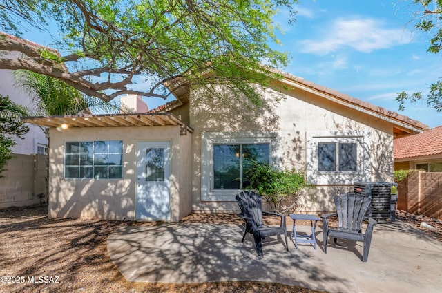 11561 N Eagle Peak Dr, Oro Valley, AZ 85737 - rear view of house with stucco siding, a patio area, and a chimney