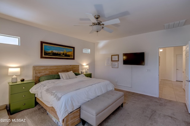 9978 N Niobrara Way, Tucson, AZ 85742 - bedroom with light carpet, a ceiling fan, and baseboards