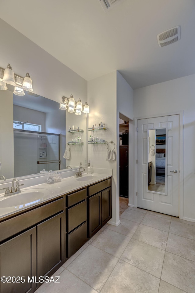 9978 N Niobrara Way, Tucson, AZ 85742 - full bathroom featuring double vanity and tile patterned floors