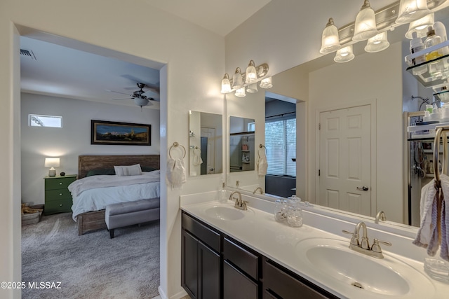 9978 N Niobrara Way, Tucson, AZ 85742 - ensuite bathroom featuring plenty of natural light, double vanity, and ceiling fan