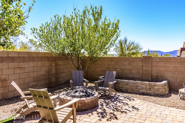 9978 N Niobrara Way, Tucson, AZ 85742 - view of patio with a fire pit and a mountain view