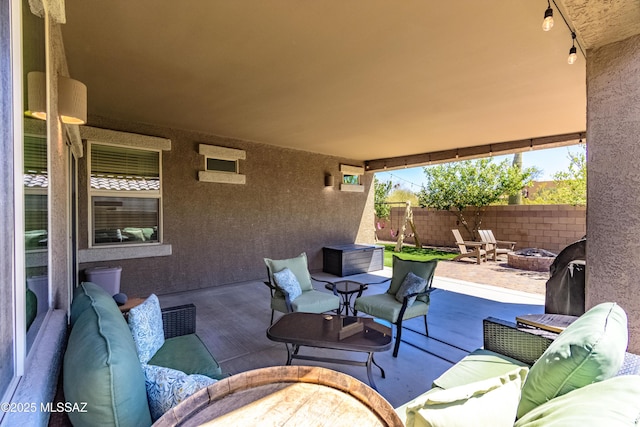 9978 N Niobrara Way, Tucson, AZ 85742 - view of patio / terrace with an outdoor living space with a fire pit