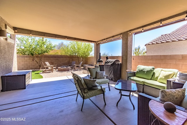 9978 N Niobrara Way, Tucson, AZ 85742 - view of patio with an outdoor living space with a fire pit
