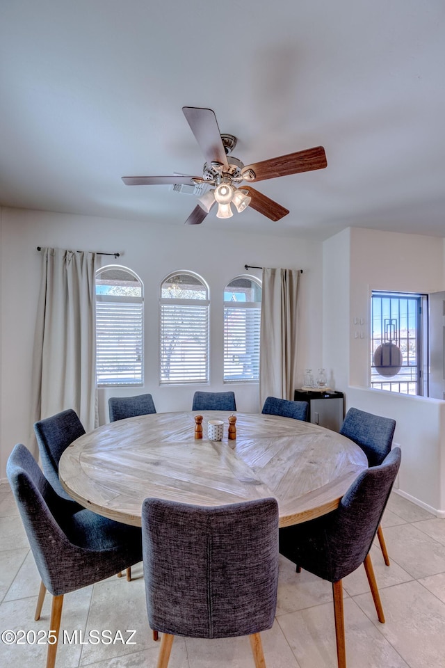 9978 N Niobrara Way, Tucson, AZ 85742 - dining room featuring plenty of natural light, light tile patterned floors, and a ceiling fan