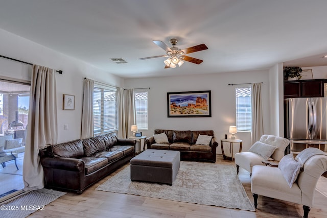 9978 N Niobrara Way, Tucson, AZ 85742 - living area featuring a ceiling fan and light wood-style floors