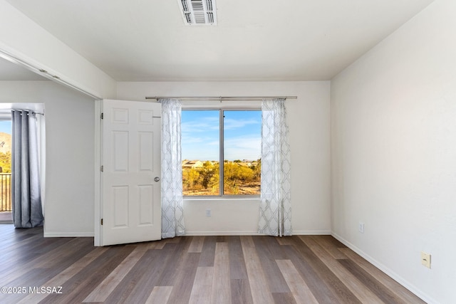 11262 N Chynna Rose Pl, Oro Valley, AZ 85737 - empty room with wood finished floors and baseboards