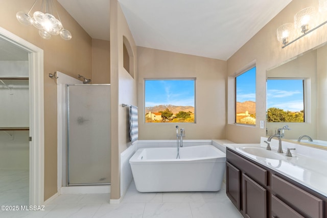 11262 N Chynna Rose Pl, Oro Valley, AZ 85737 - full bathroom featuring a walk in closet, a stall shower, a freestanding bath, vanity, and lofted ceiling