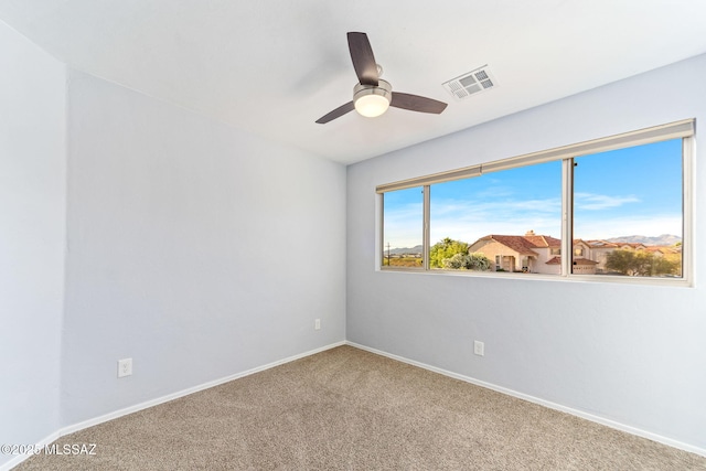 11262 N Chynna Rose Pl, Oro Valley, AZ 85737 - unfurnished room featuring carpet flooring, a ceiling fan, and baseboards