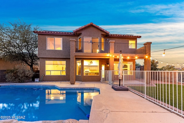 11262 N Chynna Rose Pl, Oro Valley, AZ 85737 - back of property featuring a balcony, a patio, stucco siding, and a tile roof