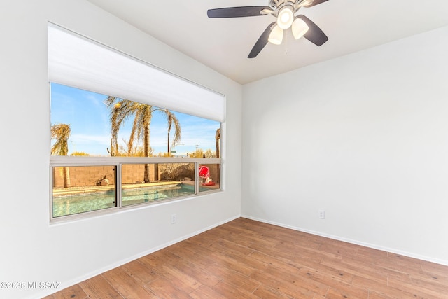 11262 N Chynna Rose Pl, Oro Valley, AZ 85737 - unfurnished room with light wood-type flooring, baseboards, and a ceiling fan