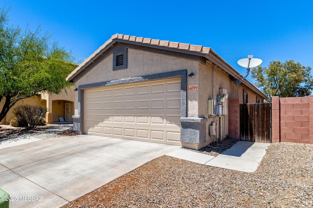 4099 E Shadow Branch Dr, Tucson, AZ 85756 - garage with driveway and a gate
