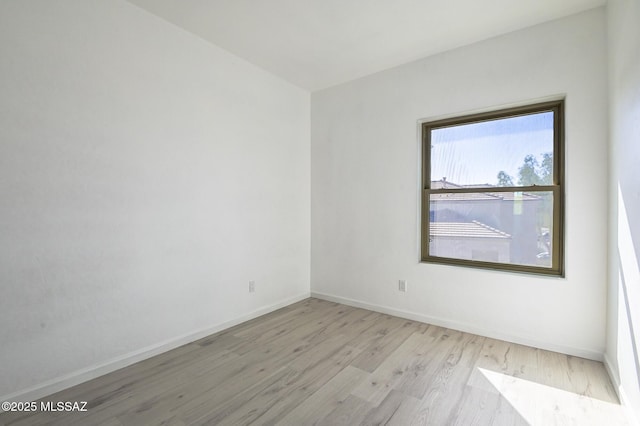 185 E Calle Zavala, Tucson, AZ 85704 - empty room featuring wood finished floors and baseboards