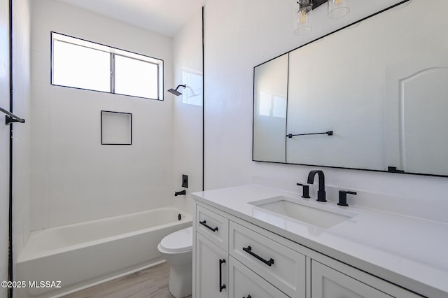 185 E Calle Zavala, Tucson, AZ 85704 - bathroom with vanity, toilet,  shower combination, and wood finished floors