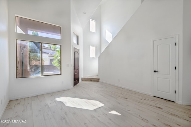 185 E Calle Zavala, Tucson, AZ 85704 - foyer entrance featuring a towering ceiling, wood finished floors, and baseboards
