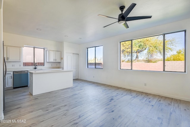 185 E Calle Zavala, Tucson, AZ 85704 - kitchen with dishwasher, light countertops, light wood-style floors, baseboards, and recessed lighting