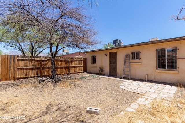 2113 N Belvedere Ave, Tucson, AZ 85712 - back of house featuring stucco siding and central air condition unit