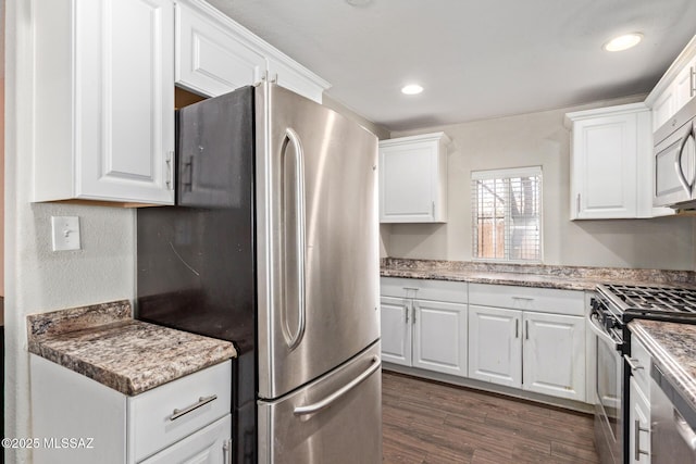 2113 N Belvedere Ave, Tucson, AZ 85712 - kitchen with stainless steel appliances, white cabinets, dark wood-style flooring, and recessed lighting