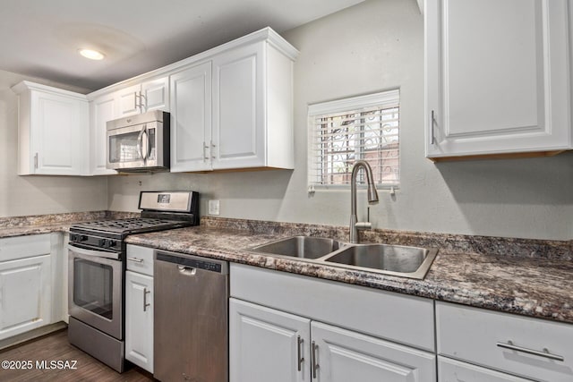 2113 N Belvedere Ave, Tucson, AZ 85712 - kitchen featuring stainless steel appliances, a sink, and white cabinets