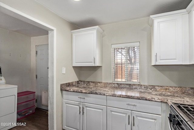 2113 N Belvedere Ave, Tucson, AZ 85712 - kitchen with washer / clothes dryer, dark wood-style flooring, and white cabinets