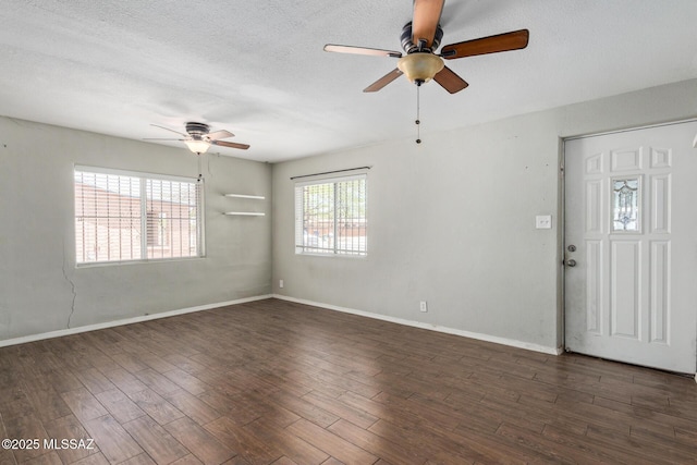 2113 N Belvedere Ave, Tucson, AZ 85712 - spare room with a ceiling fan, dark wood-type flooring, a textured ceiling, and baseboards