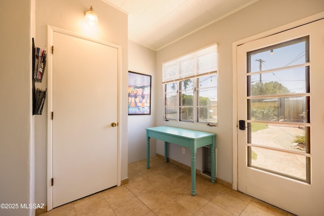 1912 E Water St, Tucson, AZ 85719 - entryway with light tile patterned floors and crown molding