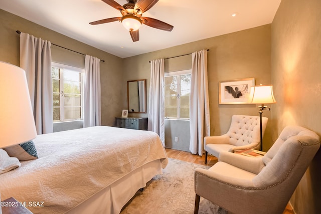1912 E Water St, Tucson, AZ 85719 - bedroom with multiple windows, light wood-style flooring, and ceiling fan
