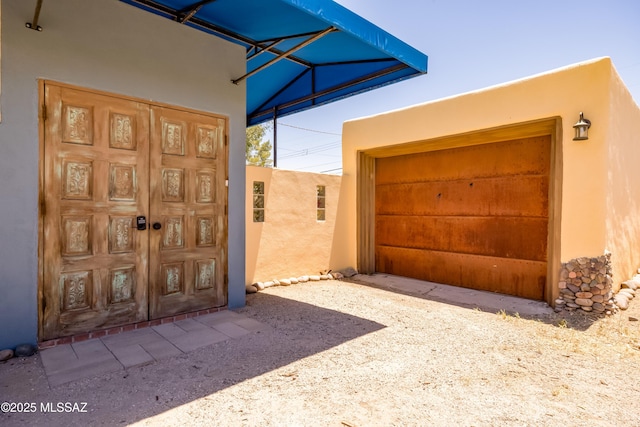 1912 E Water St, Tucson, AZ 85719 - doorway to property with stucco siding