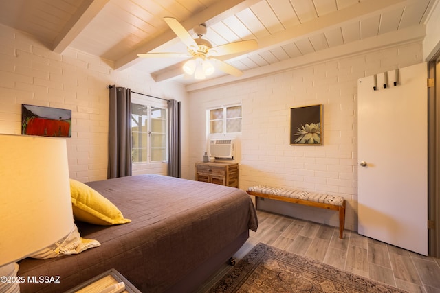 1912 E Water St, Tucson, AZ 85719 - bedroom with wood finished floors, wood ceiling with exposed beams, cooling unit, brick wall, and ceiling fan