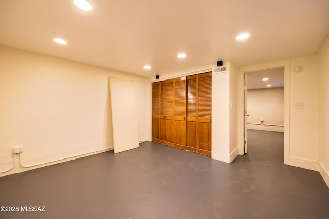 1912 E Water St, Tucson, AZ 85719 - unfurnished bedroom with finished concrete flooring, recessed lighting, a closet, and baseboards