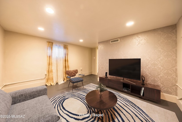 1912 E Water St, Tucson, AZ 85719 - living room featuring recessed lighting, finished concrete flooring, baseboards, and wallpapered walls