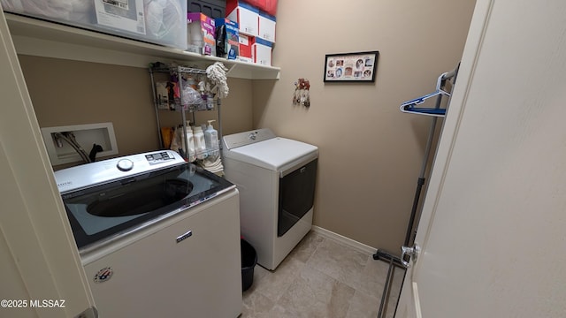 10218 S Hickory Wood Way, Vail, AZ 85641 - washroom with washer and dryer and baseboards