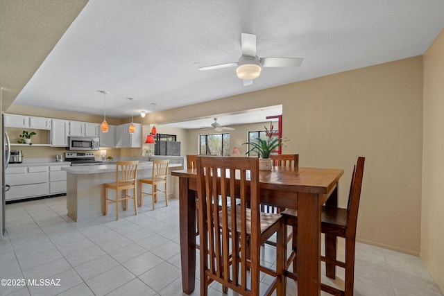 7302 E Rocky Creek Pl, Tucson, AZ 85750 - dining room with a ceiling fan and light tile patterned flooring