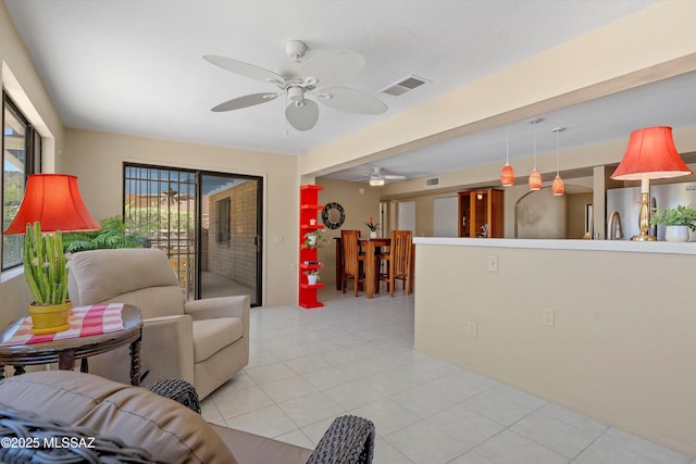 7302 E Rocky Creek Pl, Tucson, AZ 85750 - living room featuring ceiling fan and light tile patterned flooring