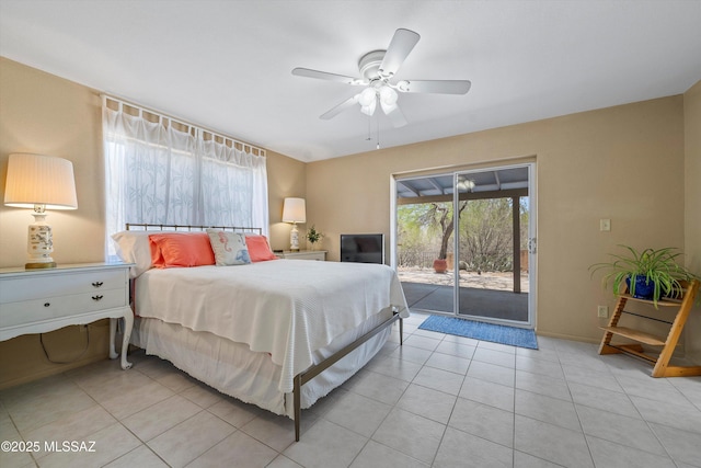 7302 E Rocky Creek Pl, Tucson, AZ 85750 - bedroom with access to exterior, multiple windows, and light tile patterned flooring