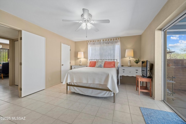 7302 E Rocky Creek Pl, Tucson, AZ 85750 - bedroom with light tile patterned floors, access to outside, and a ceiling fan