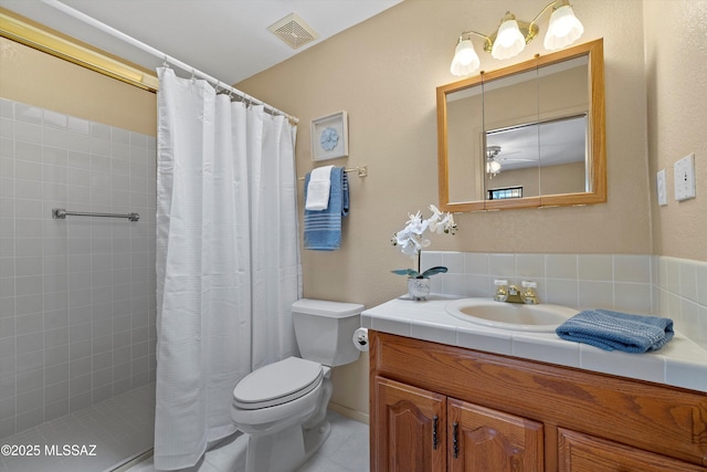 7302 E Rocky Creek Pl, Tucson, AZ 85750 - bathroom featuring toilet, vanity, a tile shower, and ceiling fan