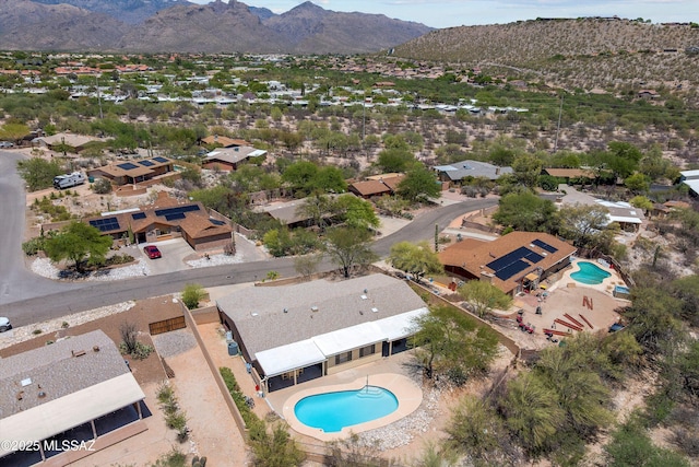 7302 E Rocky Creek Pl, Tucson, AZ 85750 - aerial perspective of suburban area with a pool and a mountainous background