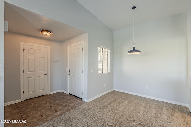 101 S Players Club Dr Unit 11204, Tucson, AZ 85745 - entryway with baseboards, dark tile patterned flooring, and dark colored carpet