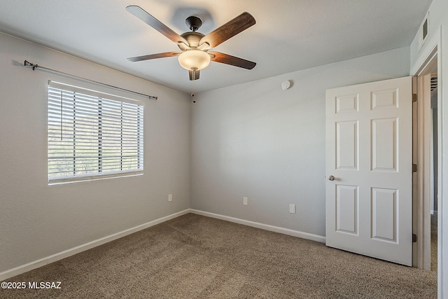 101 S Players Club Dr Unit 11204, Tucson, AZ 85745 - unfurnished room featuring a ceiling fan, carpet, baseboards, and a smoke detector