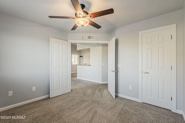 101 S Players Club Dr Unit 11204, Tucson, AZ 85745 - unfurnished bedroom with carpet flooring, baseboards, and ceiling fan