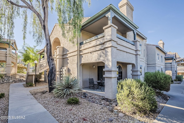 101 S Players Club Dr Unit 11204, Tucson, AZ 85745 - view of building exterior with stairs
